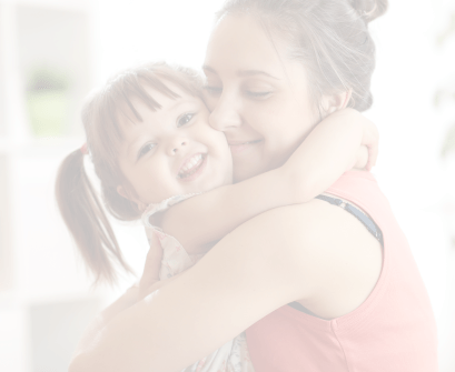 Mother hugging her toddler daughter