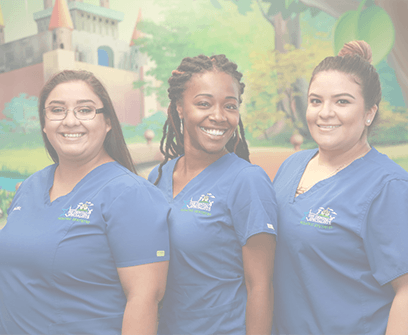Three smiling pediatric dental team members in Garland