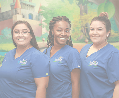 Dentist and dental team members laughing together