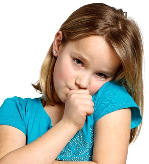A young girl wearing a teal blouse sucks her thumb
