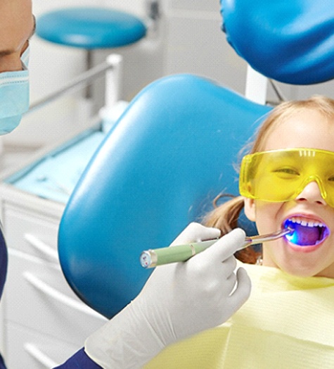 Young girl getting fillings from Garland pediatric dentist