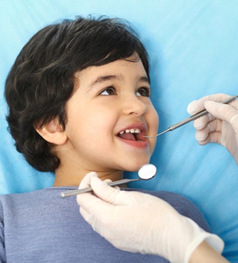 Little boy visiting his Garland pediatric dentist 