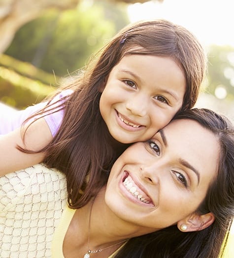 Smiling mother and daughter