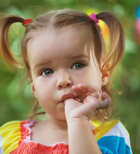 Young girl sucking her thumb