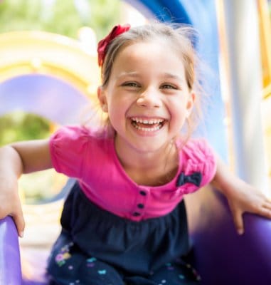 Laughing little girl after children's preventive dentistry visit