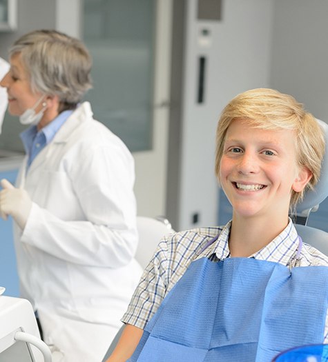 A teenage boy at the dentist