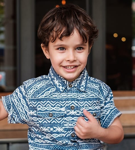 Young boy sharing healthy smile