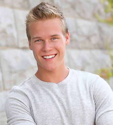 Teen boy sharing healthy smile