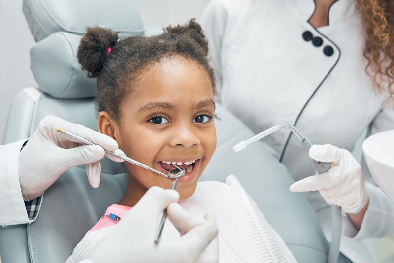 girl seeing dentist about possible root canal 