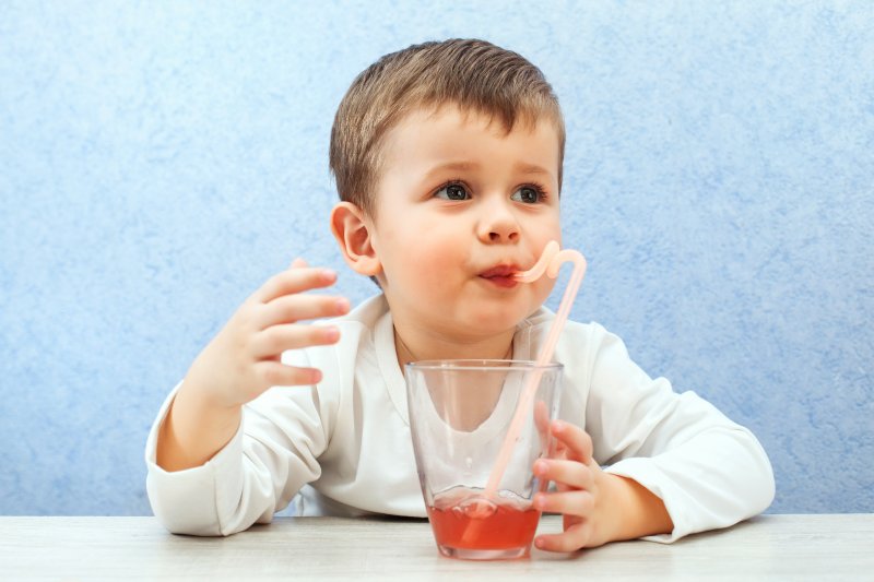 child drinking juice 