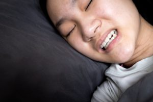 Child grinding her teeth in her sleep in Garland