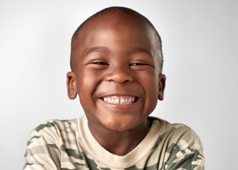 A child smiling with good oral health