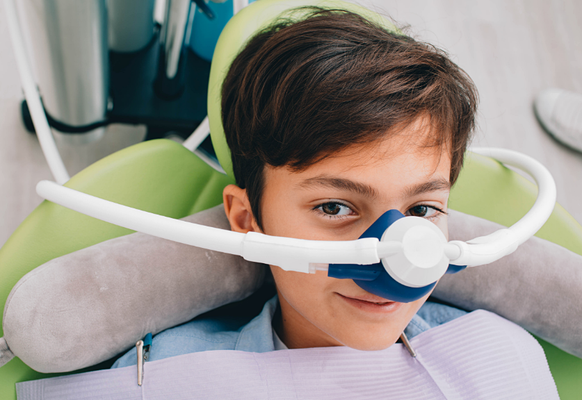 Child with sedation dentistry mask