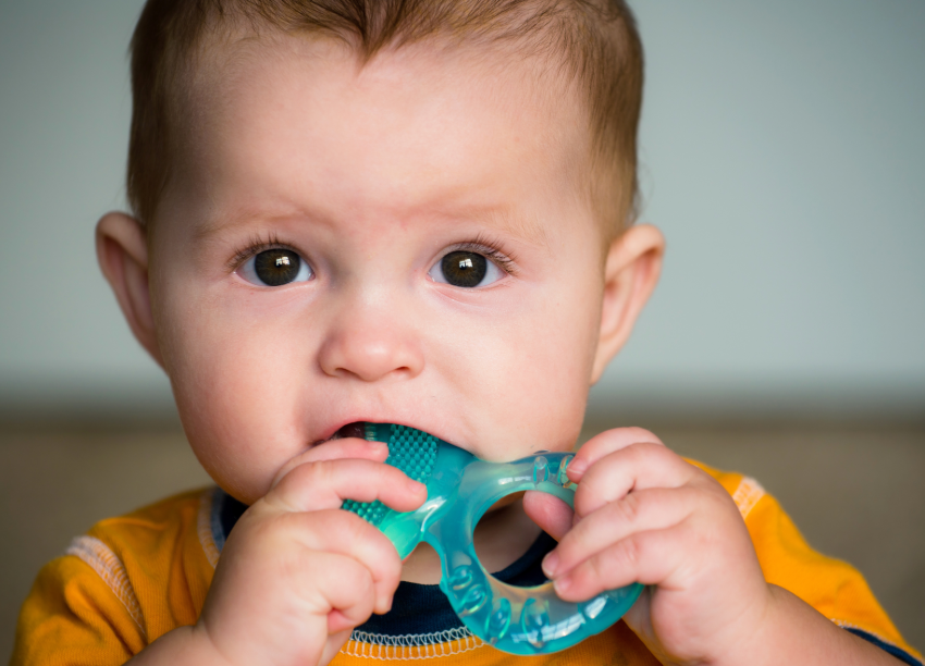 Baby with teething ring