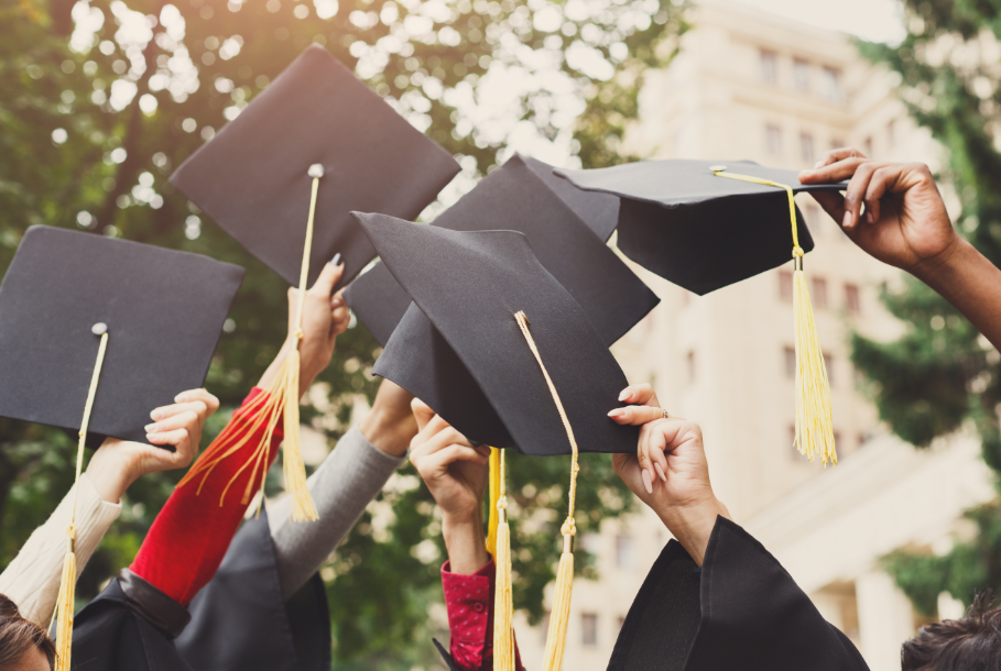 Graduation caps in the air