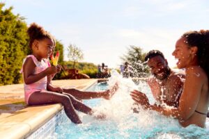 Family having a summer pool day